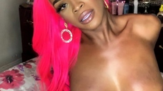 Beautiful black tranny showing off sexy ass and big tits